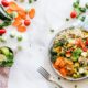 a plate of vegetables and quinoa on a set table