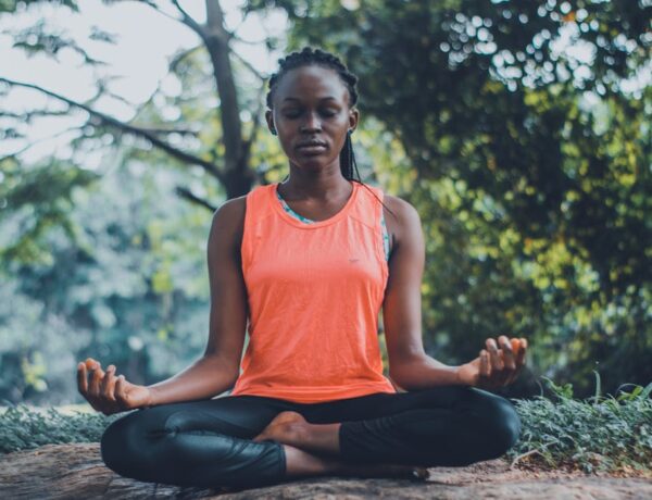 A lady meditating in the outdoors