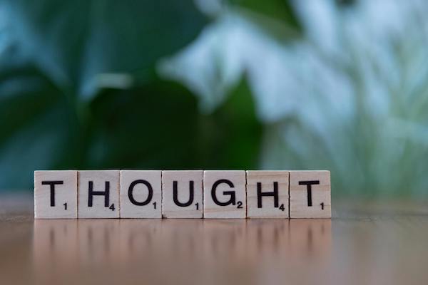 The word "Thought" spelt in scrabble